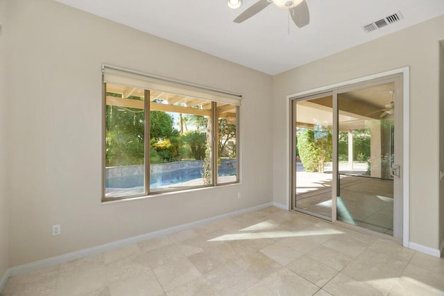 spare room with ceiling fan