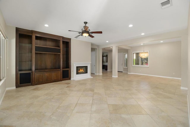 unfurnished living room with light tile patterned flooring and ceiling fan with notable chandelier