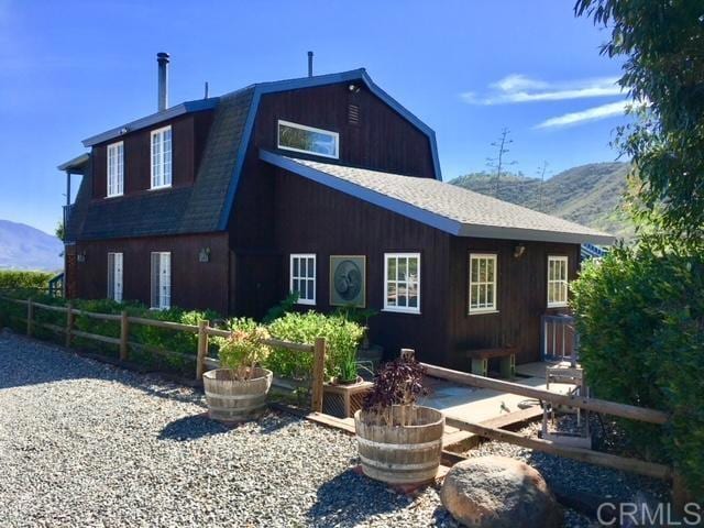 rear view of property with a mountain view