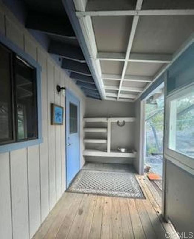 exterior space with beam ceiling and coffered ceiling