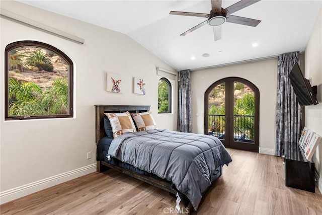 bedroom with access to exterior, ceiling fan, french doors, vaulted ceiling, and light wood-type flooring