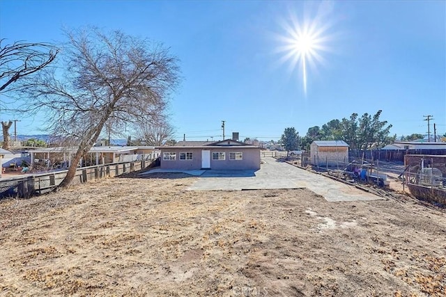 back of property featuring a patio area