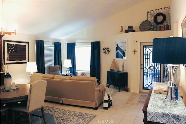 living room with light tile patterned floors and lofted ceiling