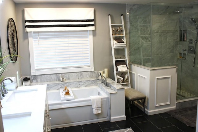 bathroom with tile patterned flooring, vanity, and shower with separate bathtub