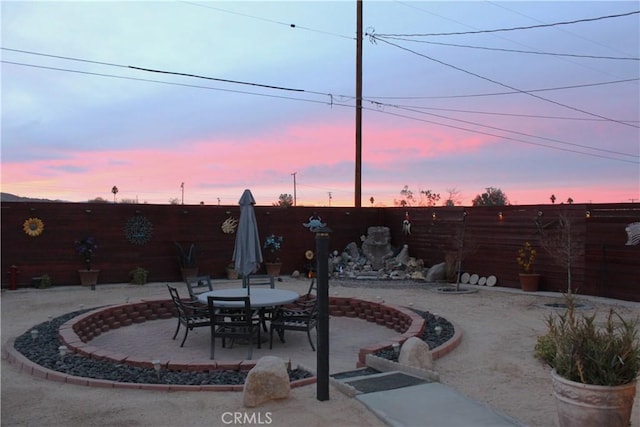 view of patio terrace at dusk