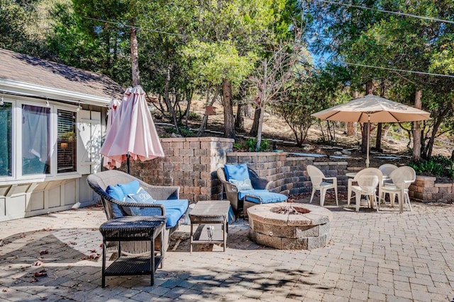 view of patio featuring an outdoor fire pit