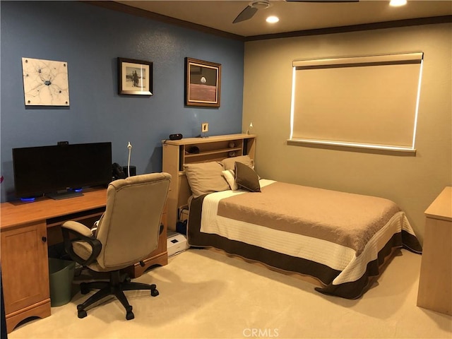 bedroom with light colored carpet, ceiling fan, and ornamental molding