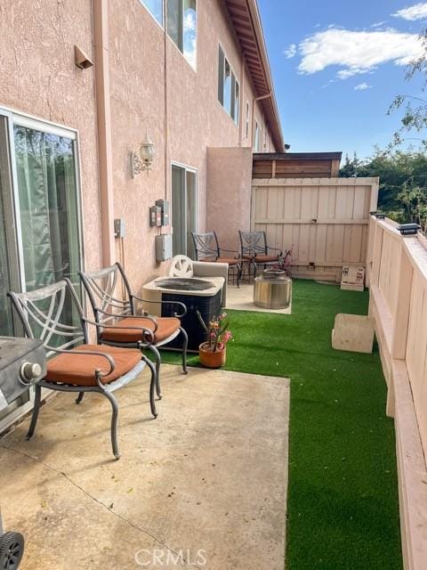 exterior space featuring a patio, fence, and central air condition unit