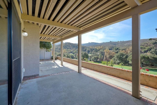 view of patio / terrace featuring a mountain view