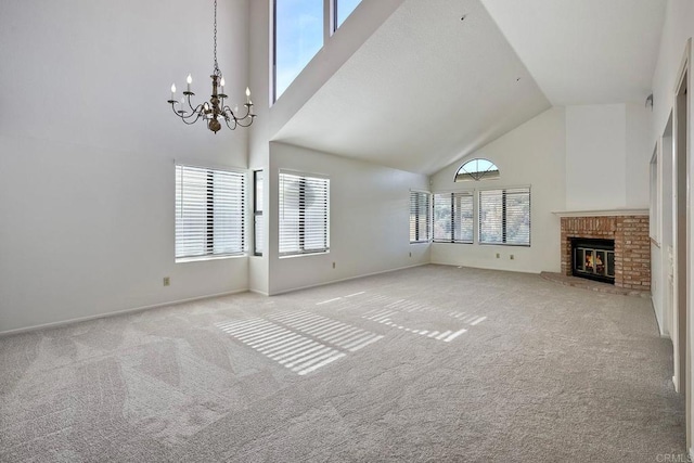 unfurnished living room with light colored carpet, a healthy amount of sunlight, a fireplace, and high vaulted ceiling