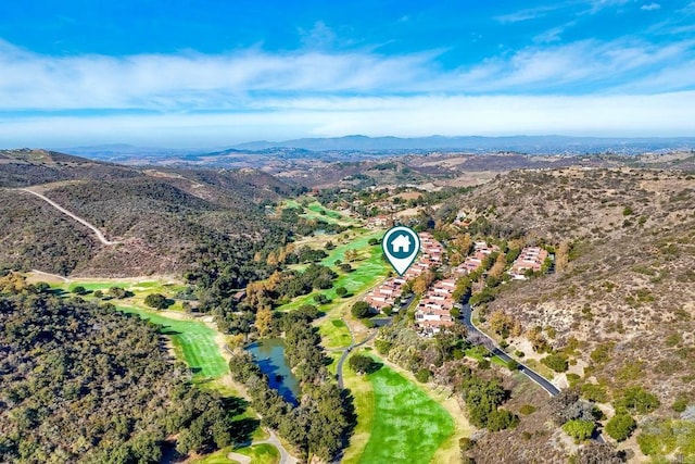 birds eye view of property with a mountain view