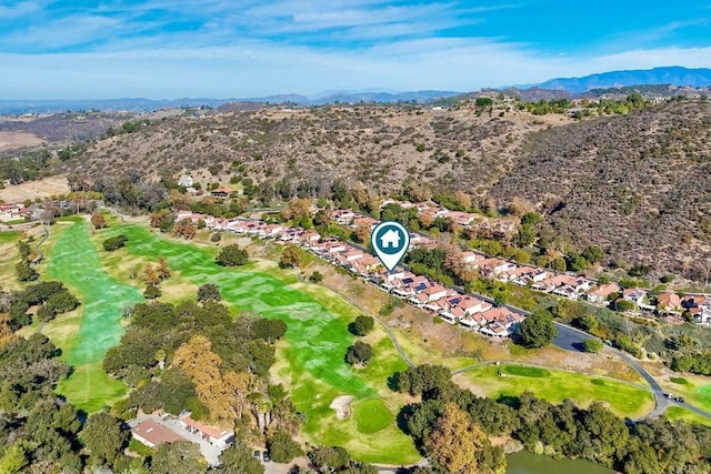 bird's eye view with a mountain view and view of golf course