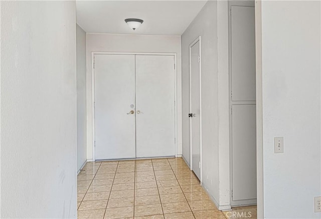 hallway featuring light tile patterned floors