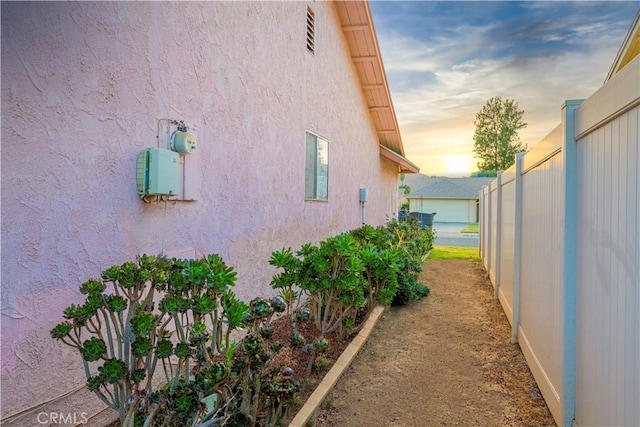 view of property exterior at dusk