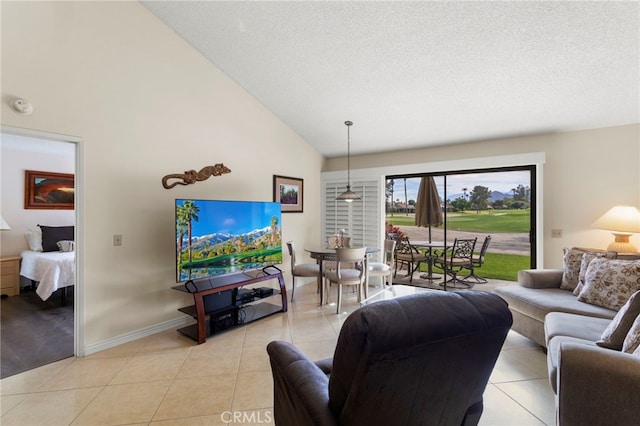 tiled living room featuring high vaulted ceiling and a textured ceiling