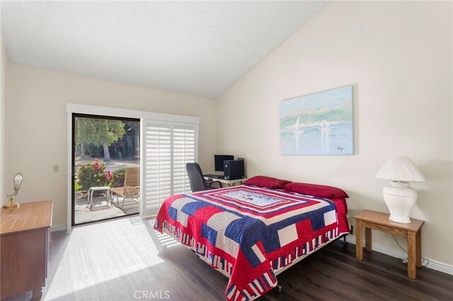 bedroom with dark wood-type flooring, access to outside, and vaulted ceiling