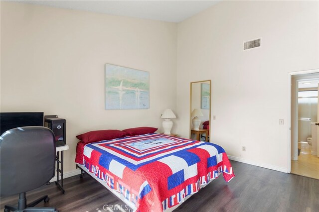 bedroom featuring dark hardwood / wood-style flooring