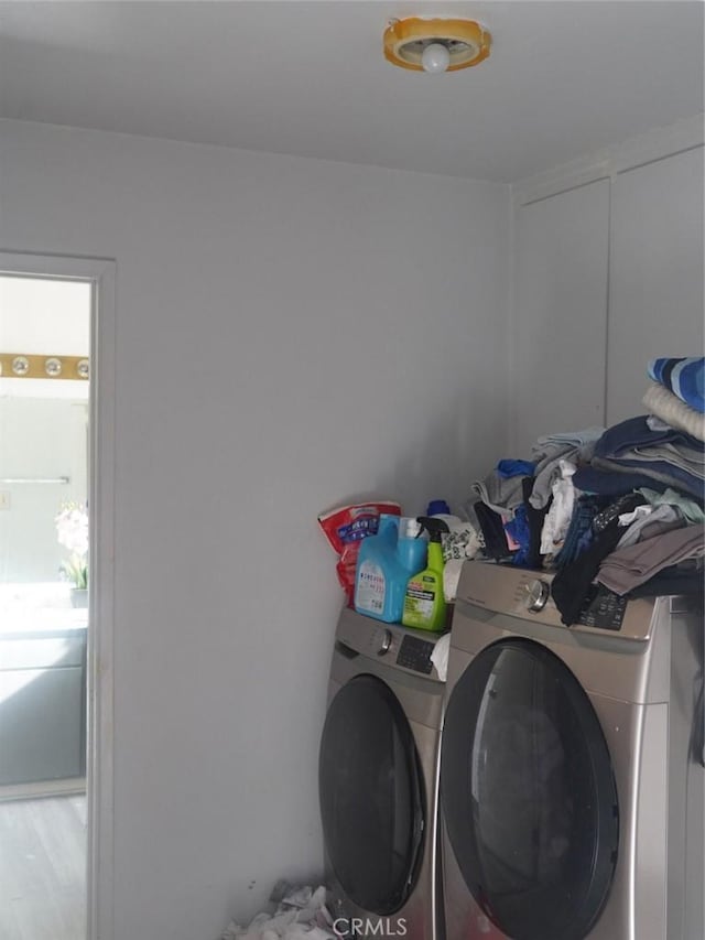 clothes washing area featuring washing machine and clothes dryer