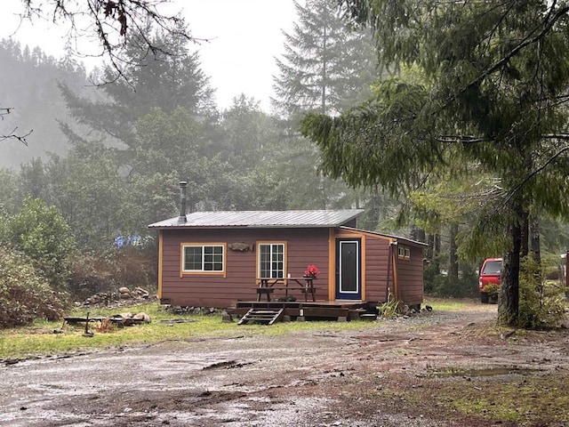 view of front of property with a wooden deck