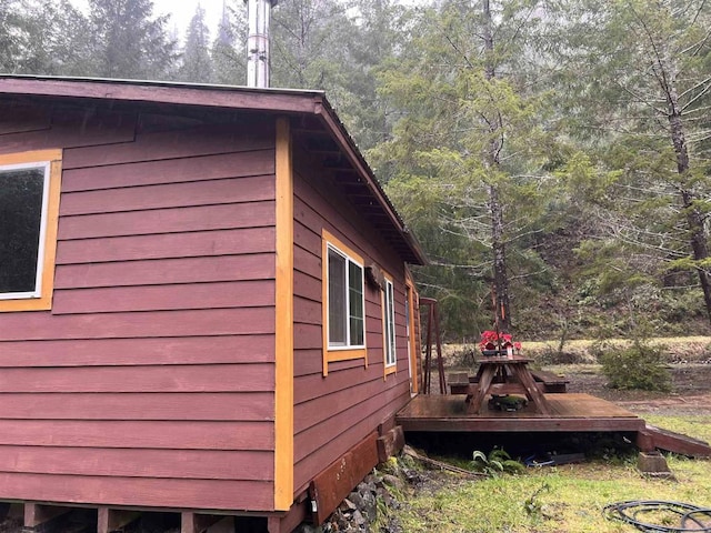 view of side of home featuring a deck