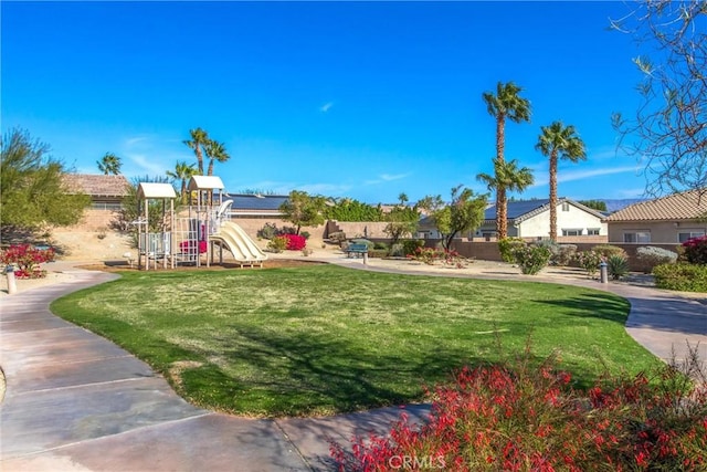 exterior space featuring playground community and a lawn