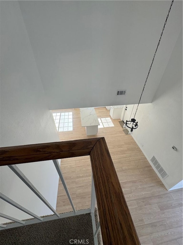 stairway featuring wood-type flooring