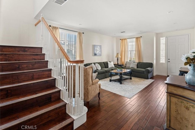 living room featuring dark wood-type flooring