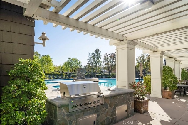 view of patio featuring sink, area for grilling, and a pergola