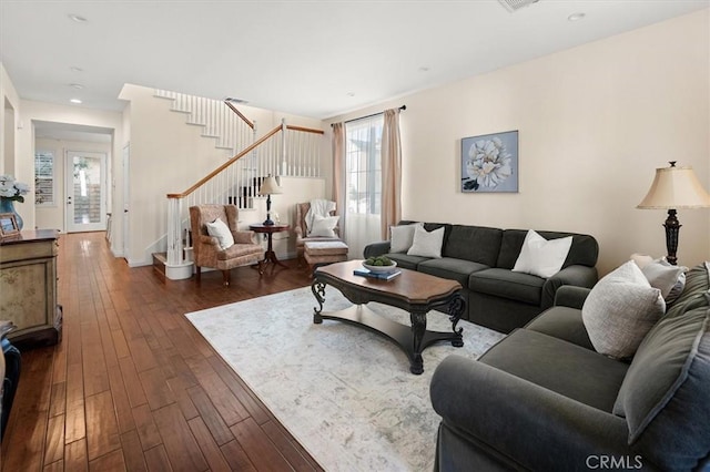 living room with dark hardwood / wood-style flooring