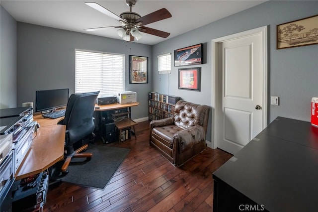 office area with ceiling fan and dark hardwood / wood-style flooring