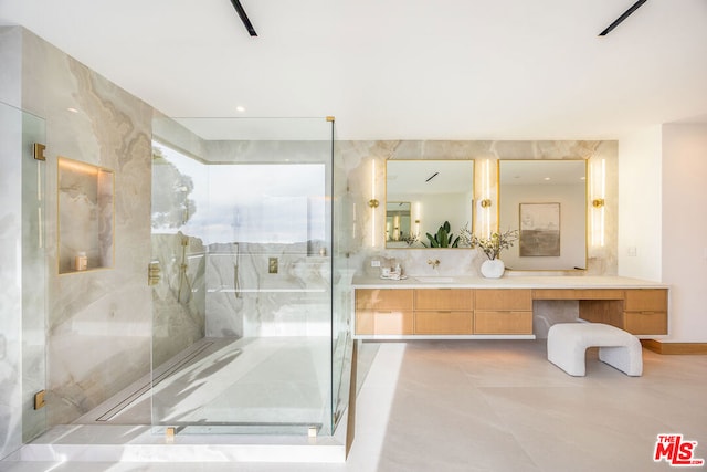 bathroom with walk in shower and vanity