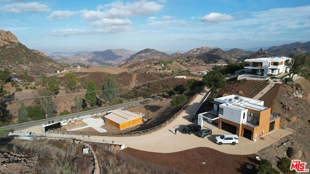 birds eye view of property featuring a mountain view