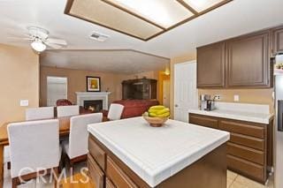 kitchen with a center island and ceiling fan