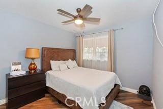 bedroom with hardwood / wood-style floors and ceiling fan