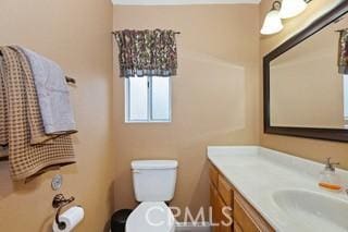 bathroom with vanity and toilet