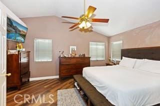 bedroom featuring ceiling fan, lofted ceiling, and dark wood-type flooring