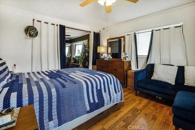 bedroom featuring ceiling fan and wood finished floors