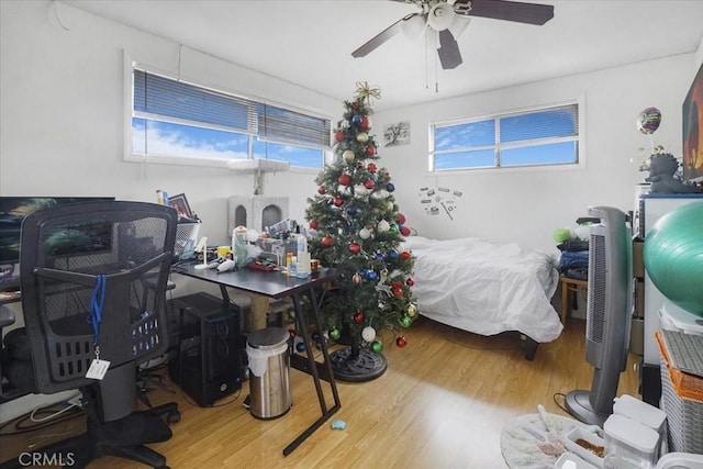 bedroom featuring ceiling fan and wood finished floors