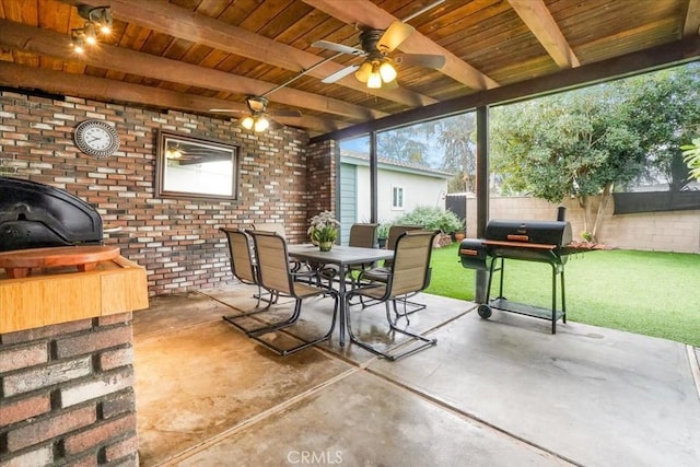 sunroom featuring beamed ceiling and wood ceiling