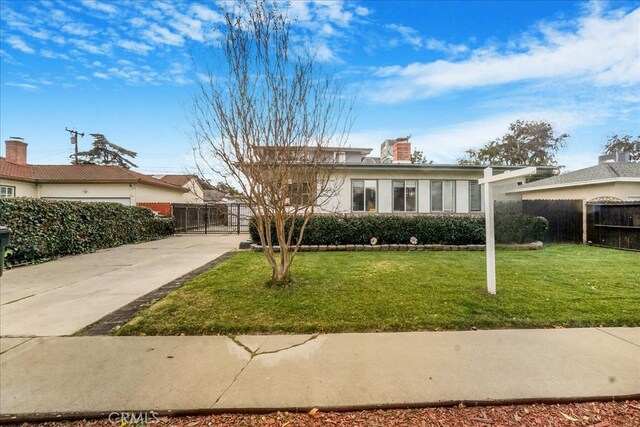 ranch-style house with a front lawn