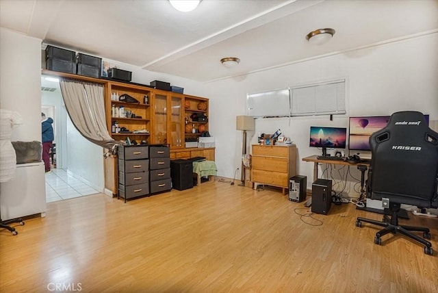 office area featuring vaulted ceiling and wood finished floors