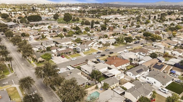 birds eye view of property with a residential view