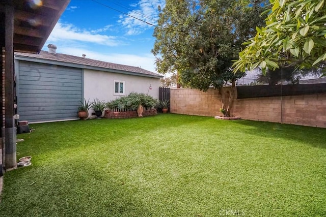 view of yard featuring fence