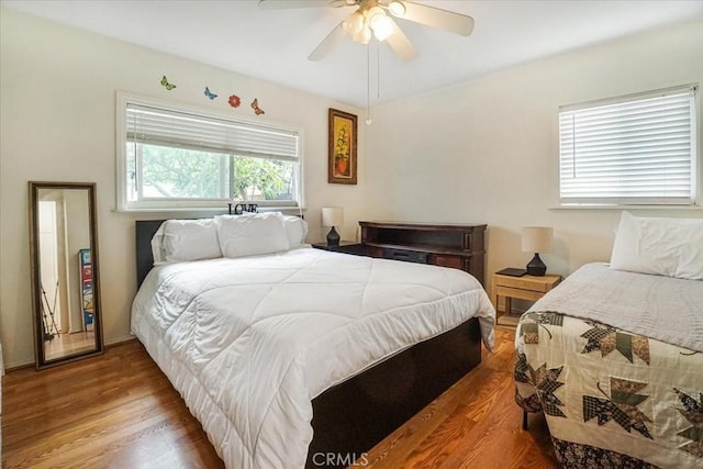 bedroom with ceiling fan and wood finished floors