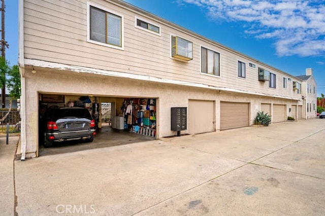 rear view of property with a garage