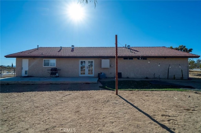 58168 Canterbury St, Yucca Valley, CA 92284 - back of house featuring french doors, a tiled roof, stucco siding, and a patio