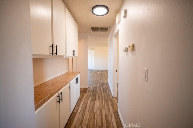 hall with light hardwood / wood-style flooring