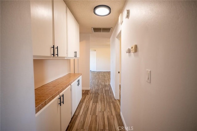 58168 Canterbury St, Yucca Valley, CA 92284 - corridor featuring wood finished floors and baseboards