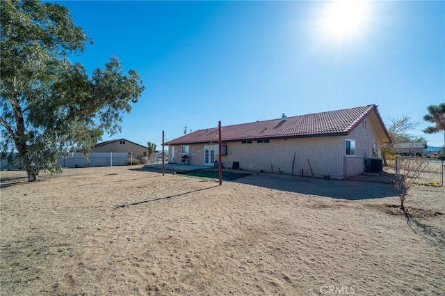 58168 Canterbury St, Yucca Valley, CA 92284 - back of house with a tile roof, stucco siding, and a patio area