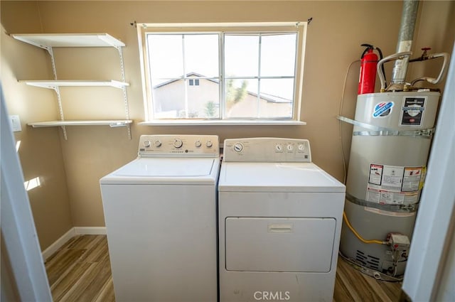 58168 Canterbury St, Yucca Valley, CA 92284 - laundry room featuring strapped water heater, washing machine and clothes dryer, and wood finished floors